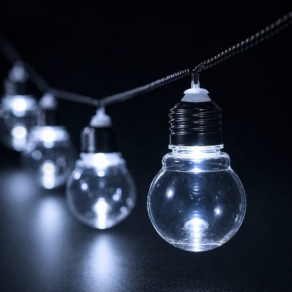 String of clear light bulbs on a black background